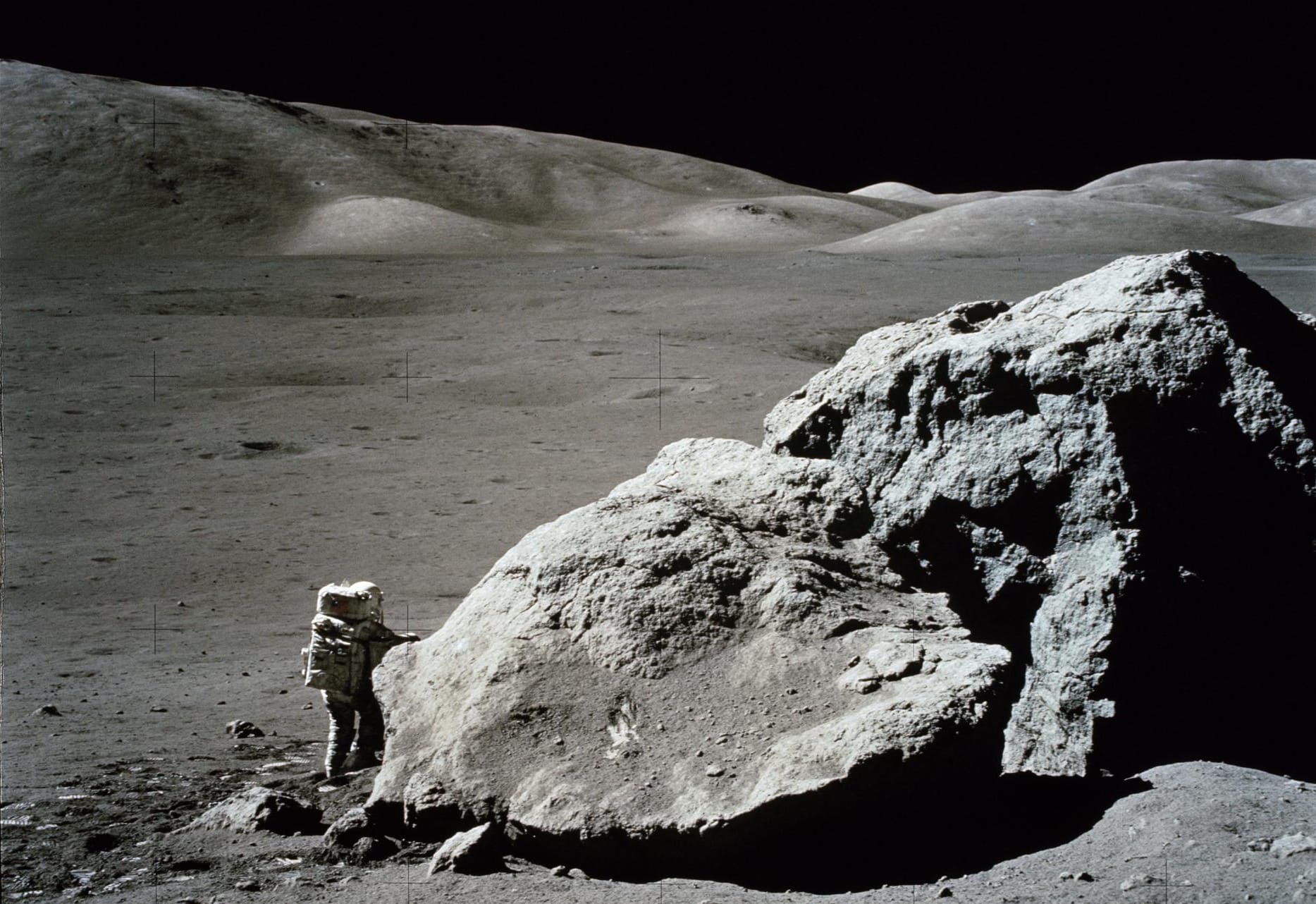 Photo of Apollo 17 geologist and astronaut Harrison Schmitt next to a large boulder at the Taurus-Littrow landing site. Source: NASA